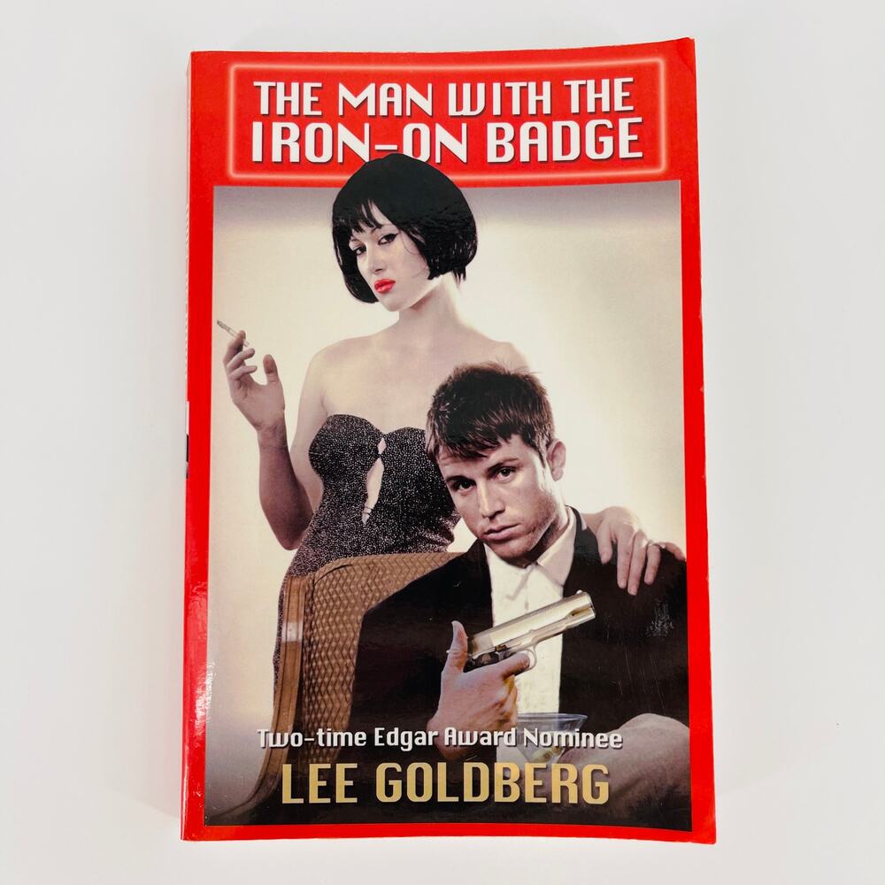 Man With The Iron-on Badge paperback book by Lee Goldberg - Good Used Condition